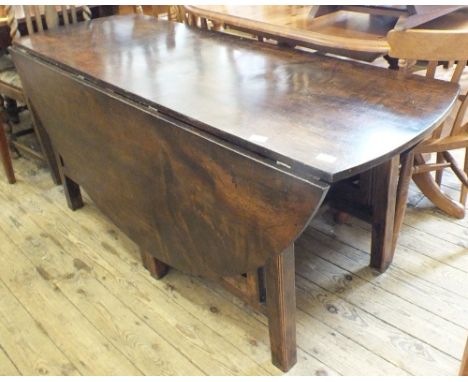 An early 19th Century circular double gate leg drop leaf dining/wake table