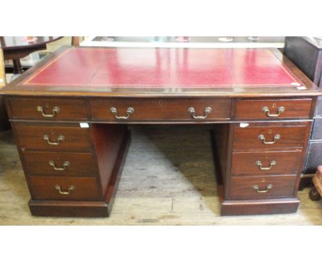 A 19th Century mahogany nine drawer pedestal desk with red leather inset top