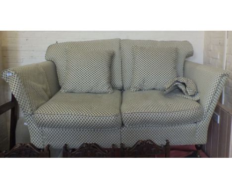 A good quality pale green and cream upholstered two seat sofa