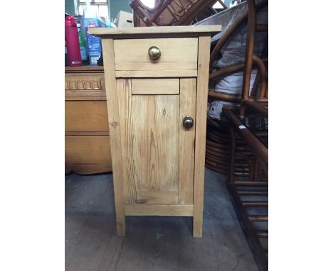 A modern pine bedside cabinet with upper drawer and lower cupboard with one shelf, H 80 cms W 42 cms D 38 cms&nbsp;