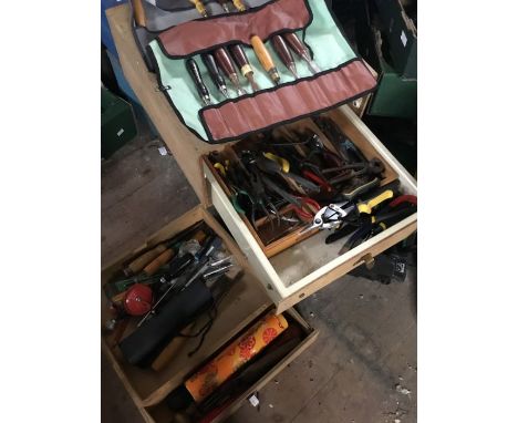 A wooden chest of two drawers containing woodworking tools including chisels, quantity of pliers, cutters etc&nbsp;