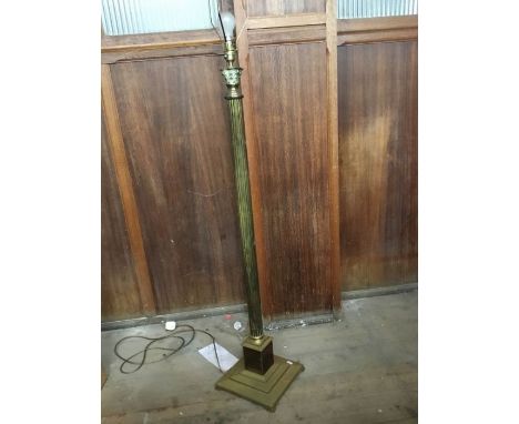 A brass standard lamp, fluted column and acanthus leaf column top , Height to bulb fitting 130 cms, with shade.&nbsp;