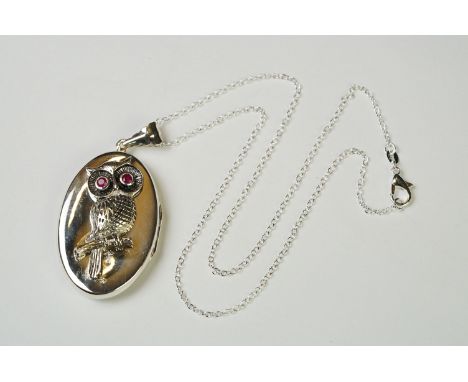 Large silver pendant photo locket in the form of an owl with ruby eyes 