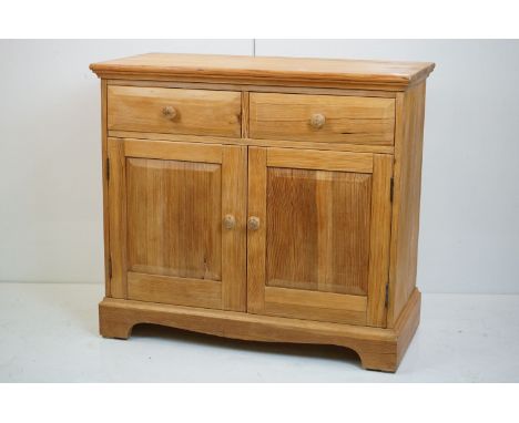 Ercol Light Elm Dresser Base with two drawers over two cupboard doors, 92cm long x 45.5cm deep x 83cm high 