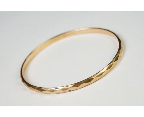 A ladies 9ct gold metal core bangle, maker marked H.G. &amp; S. 