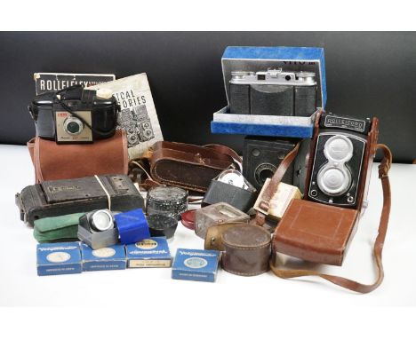 A collection of vintage photographic equipment to include a Rolleicord twin lens reflex medium format camera together with ac