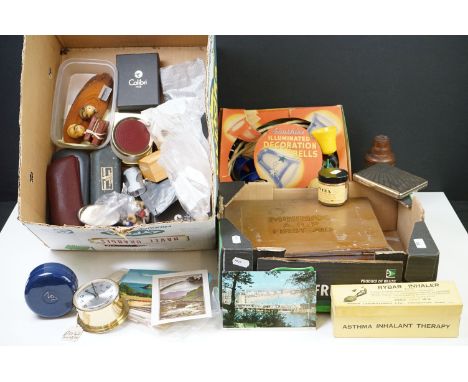 A box of mixed collectables to include pocket cigarette lighters, postcards, vintage Christmas lights, cigarette case, cuffli