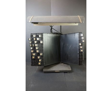 A vintage 1930's Flexoline telephone directory visible records carousel with over lamp. 