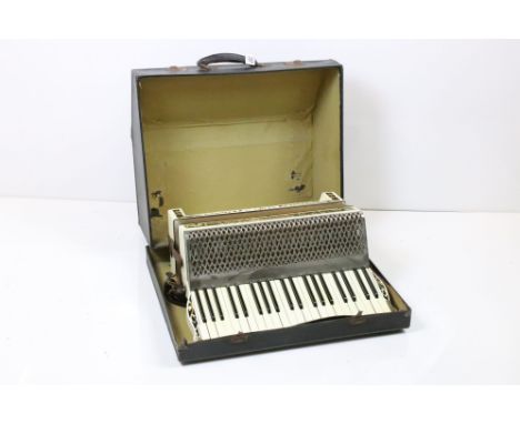A vintage Hohner Verdi III accordion within original storage case. 