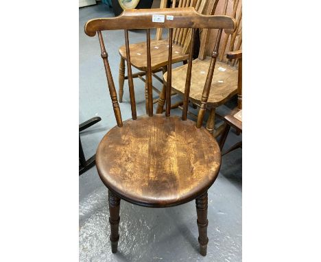 Mid 20th century stained beech stick backed chair with circular moulded seat on ring turned legs.  (B.P. 21% + VAT) 