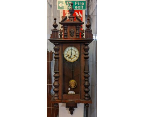 Early 20th century walnut two train presentation Vienna type wall clock, with key and pendulum. (B.P. 21% + VAT)