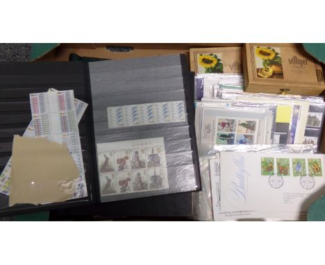 Great Britain mint and used collection of stamps in albums and stockbook, two cigar boxes, presentation packs and First Day C