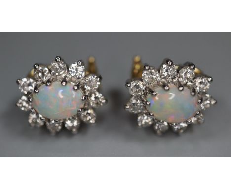 18ct gold opal and diamond clip earrings.  4.9g approx.   (B.P. 21% + VAT) 