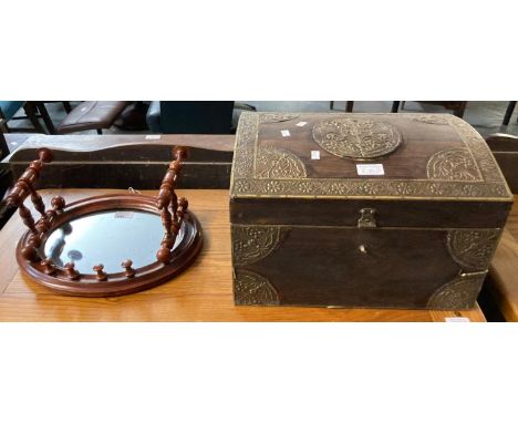 Small wooden and metal bounded dome shaped trunk/casket together with a small oval mirror flanked by folding sconces with tur