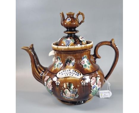 19th Century Measham pottery Bargeware baluster shaped teapot with applied sprigged decoration, marked 'Hannah Yates, Mill Ho