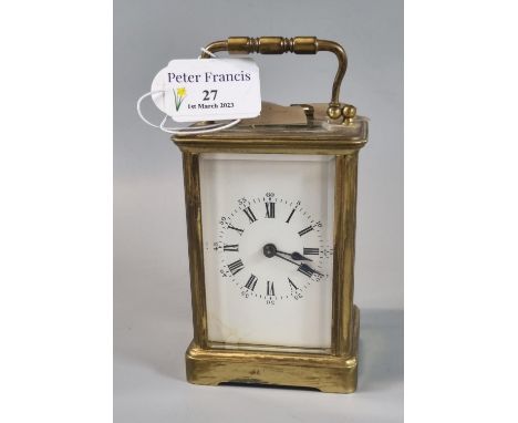 20th Century brass carriage clock with full depth Roman dial and key. 12cm high approx. (B.P. 21% + VAT) 