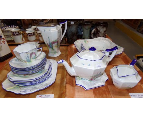 Shelley 'Queen Anne' garden pattern part tea ware, 1925-1945 period, with eight sided teapot and stand, milk jug, water jug, 