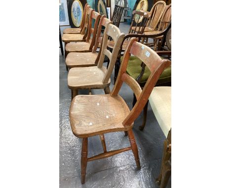Set of six very similar beech and elm Windsor bar backed kitchen chairs with moulded solid seats and ring turned legs.  (6)  