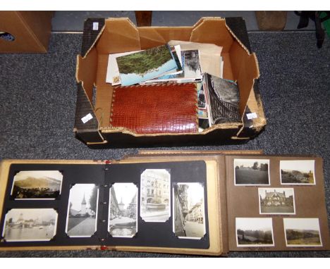 Box containing wooden cribbage board, two photograph albums with black and white photographs, one dated 1924 and one with con