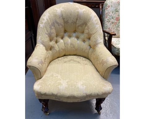 Victorian fully upholstered button backed tub chair with stuff over seat on cabriole front legs with brass casters. (B.P. 21%