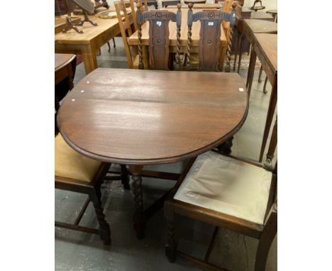 Early 20th century oak barley twist gate leg table together with a set of four oak barley twist dining chairs with drop in se