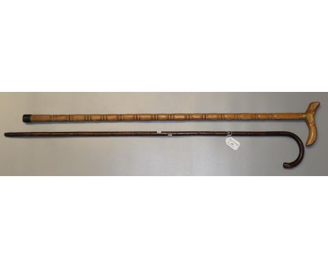 Lot 959 - Two fishing spears and a tribal stick