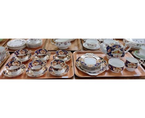 Two trays of Royal Albert English bone china 'Heirloom' design teaware to include: six teacups and saucers, teapot, sugar bow