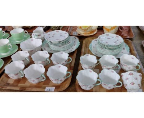 Two trays of Shelley 'Rosebud' design English fine bone china teaware, to include: teacups, saucers, small plates, sugar bowl