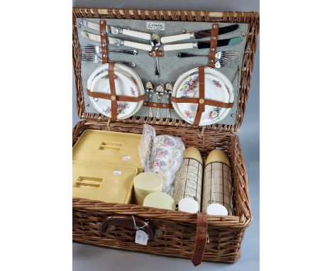 Fully fitted cane/wicker picnic hamper.  Together with a Japanese parasol.  (2)  (B.P. 21% + VAT) 