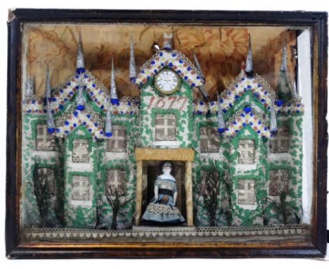 A crumb coated porcelain and bisque diorama, formed as a stately home centred by a watch above figure of a lady, on a natural