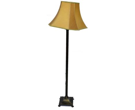A 20thC metal lamp standard, with fluted stem on a stepped square base terminating in hairy paw feet, with shade, 164cm H.