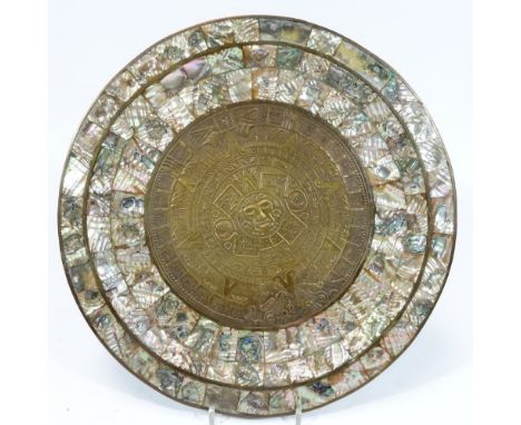 A 19thC Indo Portuguese dish, of circular form, with outer mother of pearl sections and inner metal centre, decorated and rai