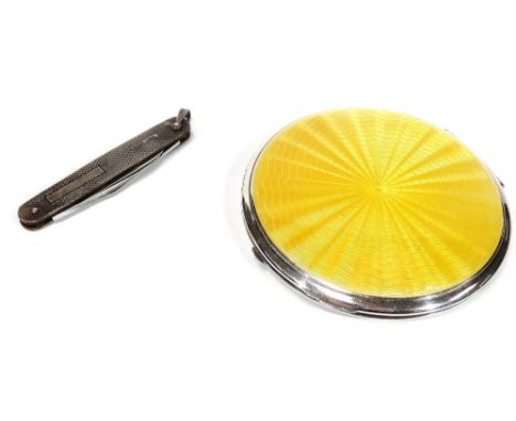 An Art Deco enamel and chrome plated powder compact, of circular form, 9cm Dia., with outer velvet case, and an engine turned