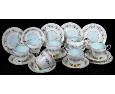A 20thC Paragon part service, unregistered and specially commissioned pattern, in gilt highlighted scrolls, in blue on white 