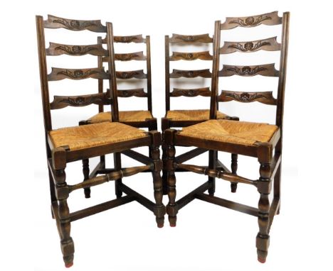A set of four ladder back rush seated dining chairs, on turned front legs joined by a turned stretcher, 108cm H.  (4)