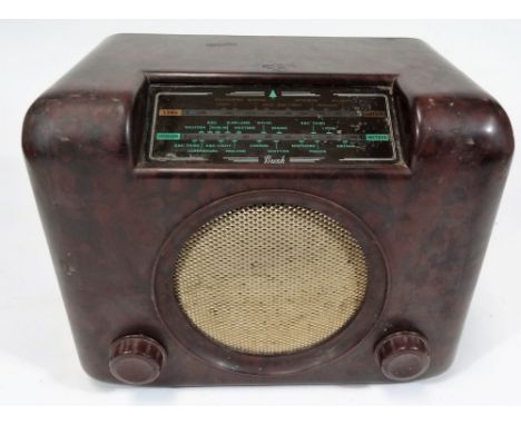 A mid 20thC Bush DAC90A Bakelite cased radio, of rectangular form, with mesh work speaker and front tuning knops, 30cm W.