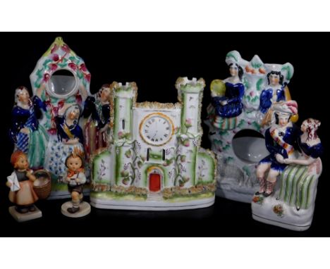Various 19thC and other pottery, comprising of a Staffordshire pottery watch group, 27cm H, set with three figures, polychrom