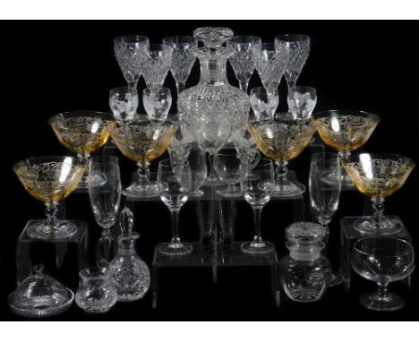 A set of six crystal wine glasses, each hobnail cut with a mitre decoration, on shaped stems and circular sun cut feet, in th