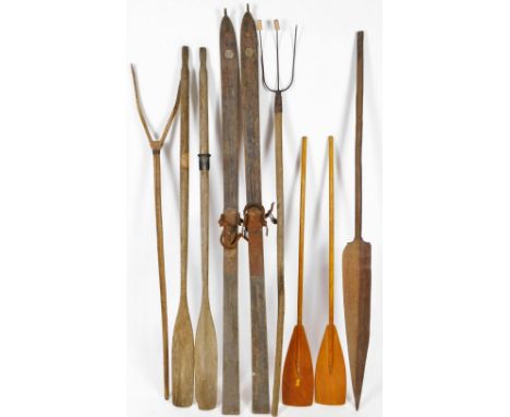 Various bygone tools, a French two pronged hay fork, 158cm H, skis, two oars, three pronged pitch fork, etc.  (a quantity)