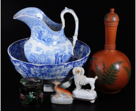 A 19thC red ware pottery decanter and cover, of bulbous form decorated with fern leaves, in green on a orange ground, unmarke