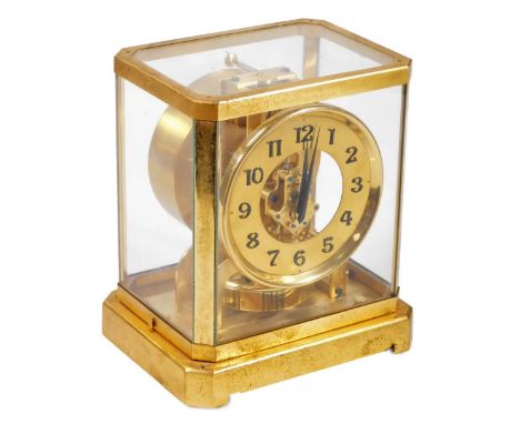 A Jaeger LeCoultre Atmos mantel clock, in a four part glazed case with gilt metal surround, 13cm Dia. Arabic dial, numbered 6