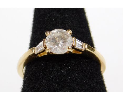 An 18ct gold diamond ring, set with central round brilliant cut diamond, approx 0.8cts, in four claw setting, colour G-H, Cla