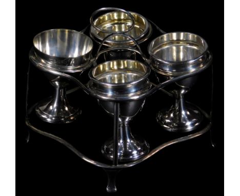 A George III silver cruet stand, with central loop handle and four circular ring holders, with shaped sides and slightly spla