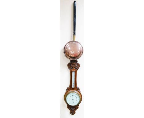 Gaydon &amp; Sons, Kingston upon Thames.  An early 20thC oak cased barometer and thermometer, the heavily carved case surmoun