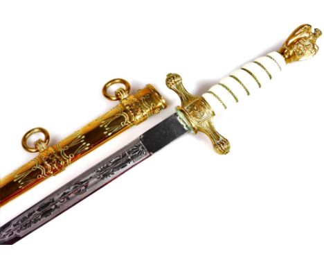 A reproduction Nazi type dagger, with Imperial Eagle pommel, turned grip handle, elaborate scabbard and etched blade, 41cm W.