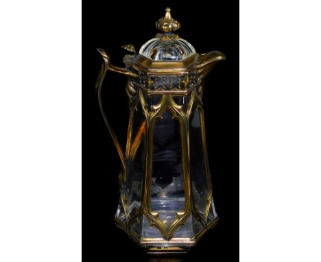 A Victorian crystal and silver-gilt Gothic framed claret jug, by Edward H Stockwell, with inverted finial, shaped spout, flor