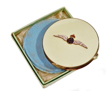 A mid 20thC RAF powder compact, of circular form with thumb mould handle, raised enamel wings and a fitted interior, 9cm Dia.