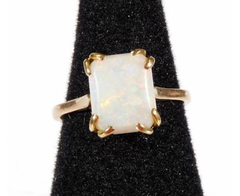 A 9ct gold opal dress ring, with rectangular cut opal in claw setting, basket set, ring size N, 2g all in. 