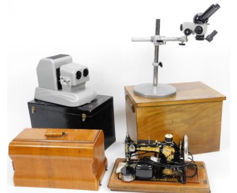 A rectangular box containing a Russian microscope with lens and other accessories, an M5C-2 Russian lens stand, 45cm H, vario