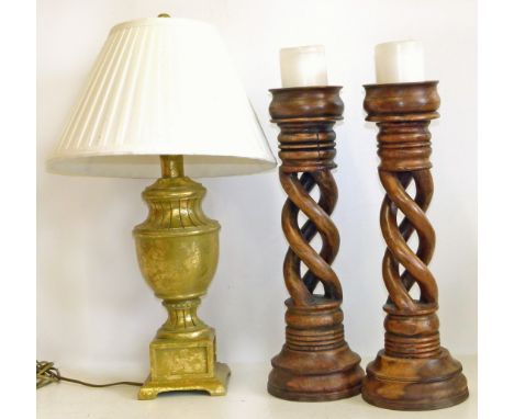 Modern gilded table lamp and a pair of spiral carved candlesticks Condition reports not available for this auction